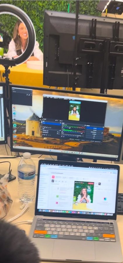 DCA operator monitoring a TikTok Shop live session on a laptop and monitor